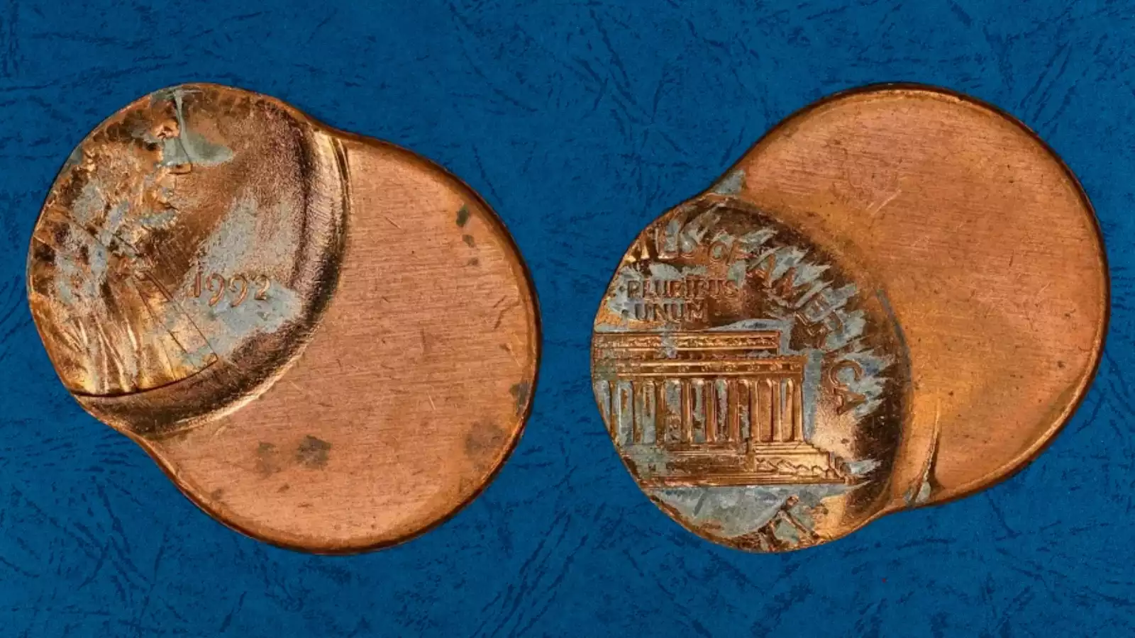 1992 penny off-center strike error showing design shifted with blank planchet area and visible date